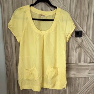 Warm yellow blouse, light material